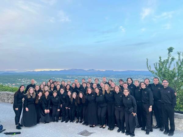 The ND Band poses in front of the scenic town of Opatija, Croatia during its 2025 International Tour to Europe