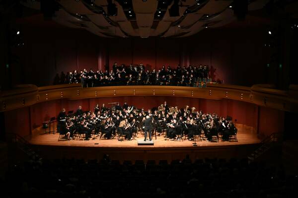 The combined ND Symphonic Winds & Band perform on stage together at the DeBartolo Performing Arts Center at one of their annual concerts